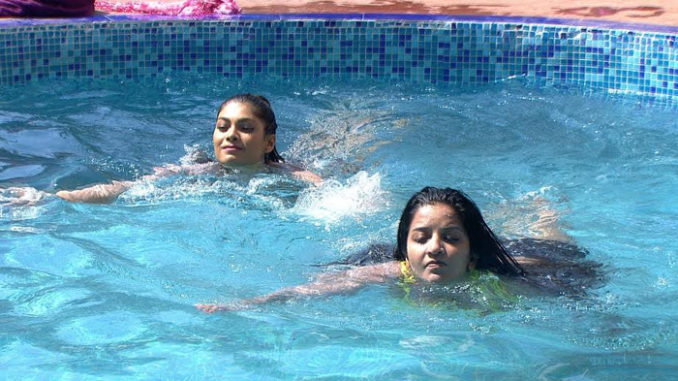 Lopa and Mona enjoy a dip in the pool