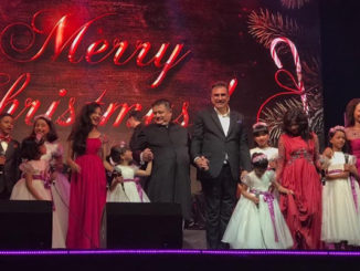 Boman Irani on stage with the choir