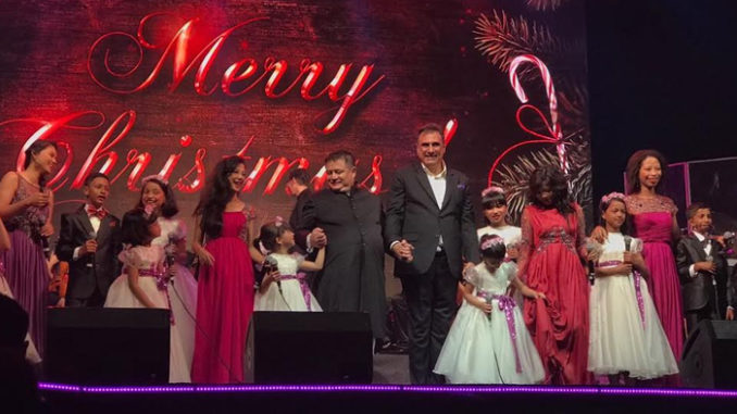 Boman Irani on stage with the choir
