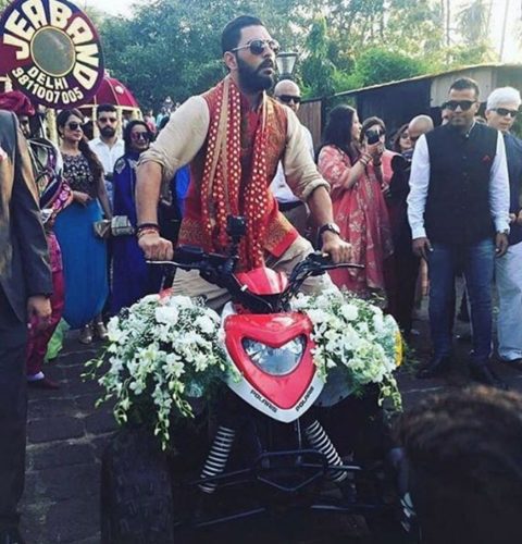Yuvraj Singh arrives on a bike for his beach wedding in Goa