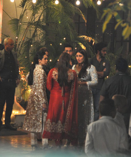 Karisma Kapoor, Kareena Kapoor Khan chatting with guests at the party