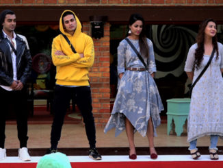 Contestants performing the captaincy task
